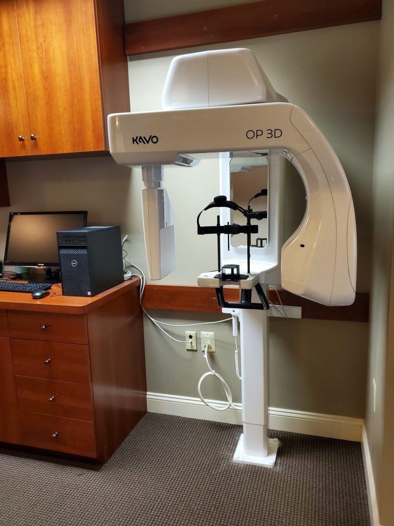 Kavo Op 3D imaging system next to computer at {PRACTICE_NAME}